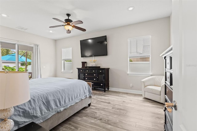 bedroom featuring light hardwood / wood-style floors and ceiling fan