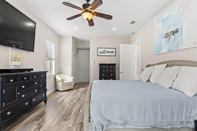 bedroom featuring hardwood / wood-style flooring and ceiling fan