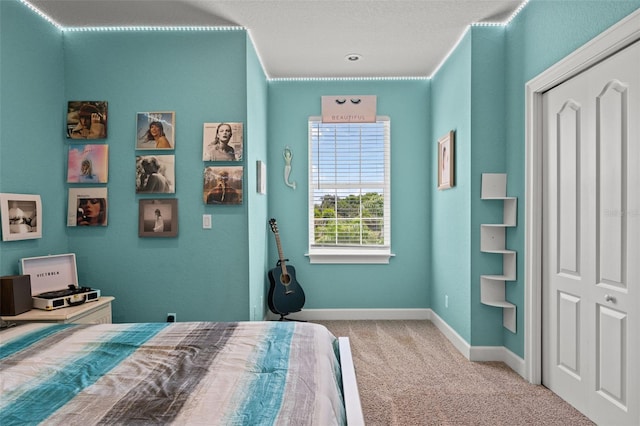 carpeted bedroom featuring a closet