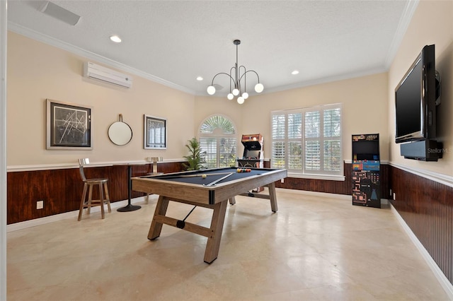 game room with crown molding, pool table, a wall mounted AC, and wood walls