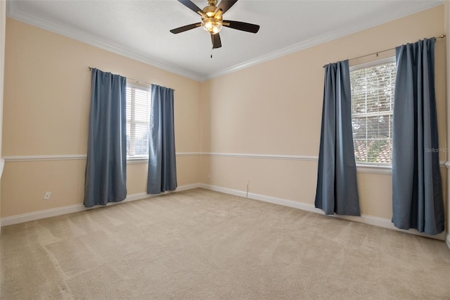 unfurnished room featuring crown molding, light colored carpet, and a healthy amount of sunlight