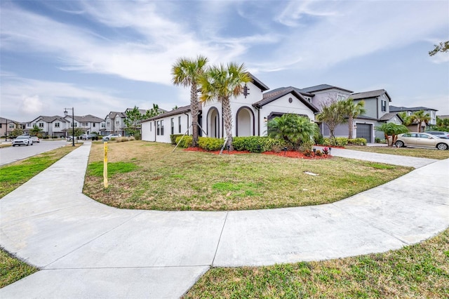 view of front of house featuring a garage and a front yard