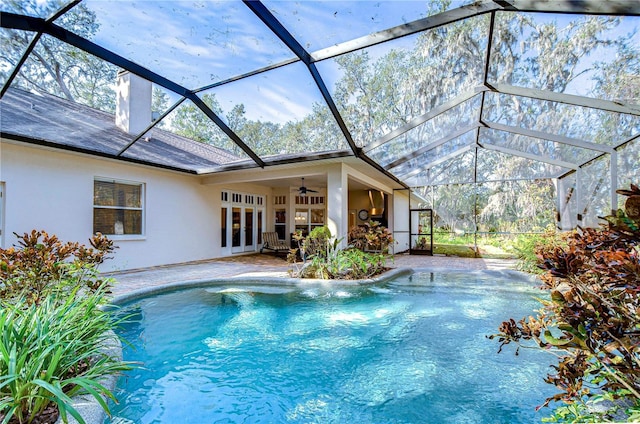 view of pool featuring a patio, a lanai, and ceiling fan