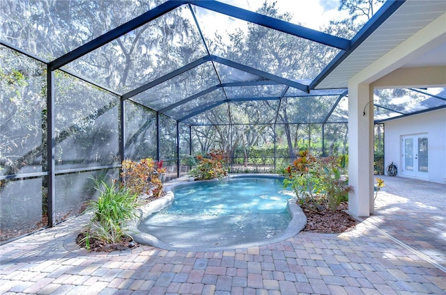 view of patio / terrace featuring glass enclosure