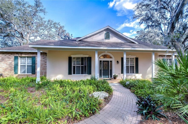 view of front of property featuring covered porch