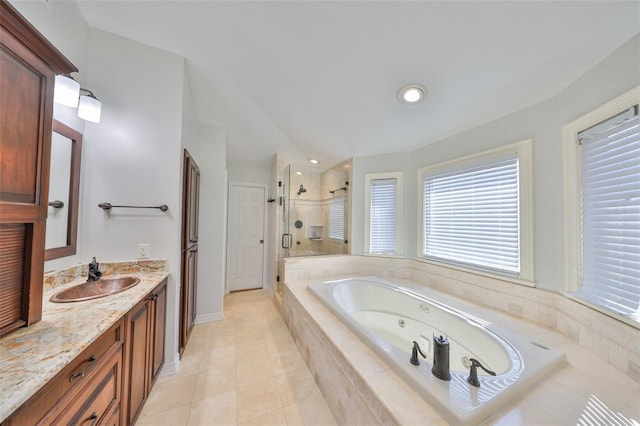 full bathroom featuring vanity, baseboards, tile patterned floors, a whirlpool tub, and a stall shower