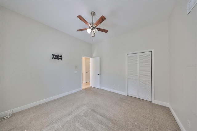 unfurnished bedroom featuring a closet, carpet flooring, visible vents, and baseboards