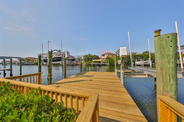 dock area featuring a water view and boat lift