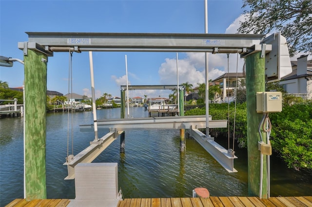 view of dock with a water view and boat lift