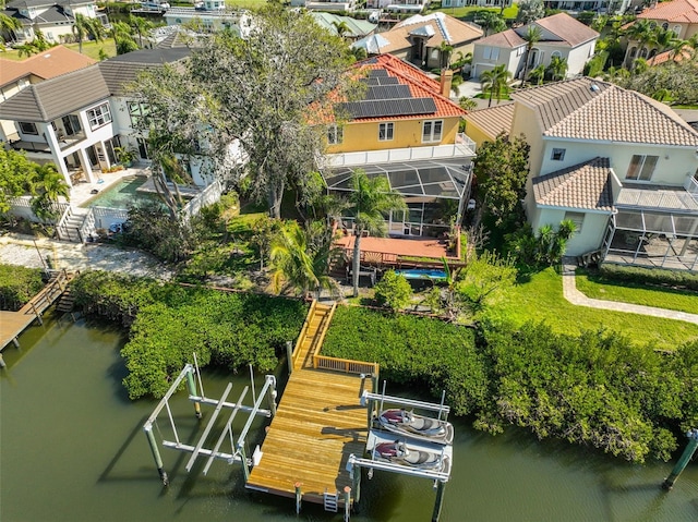 aerial view with a water view and a residential view