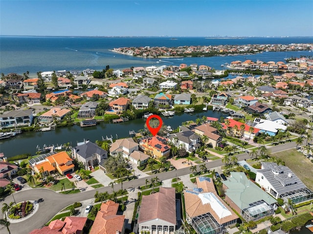 bird's eye view featuring a water view and a residential view