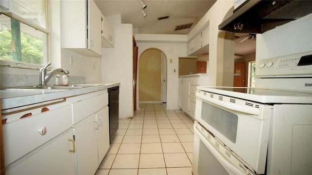 kitchen featuring range with two ovens, dishwasher, sink, and white cabinets