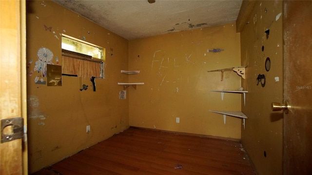 unfurnished room featuring wood-type flooring