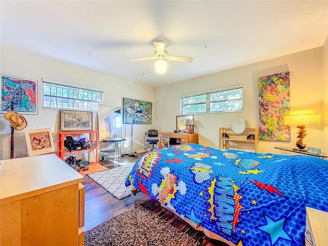 bedroom with hardwood / wood-style flooring and ceiling fan