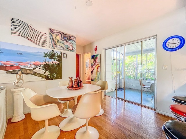 dining room with hardwood / wood-style flooring