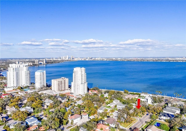 birds eye view of property with a water view