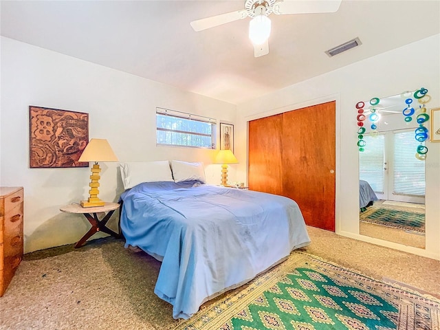 bedroom featuring a closet, ceiling fan, and carpet flooring