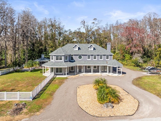 view of front of home with a front yard and a porch