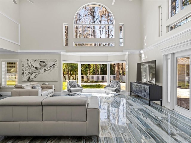 living room featuring a towering ceiling