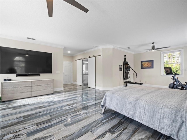 bedroom with crown molding, a barn door, ceiling fan, and a textured ceiling