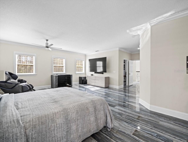 bedroom featuring ornamental molding, multiple windows, and a textured ceiling