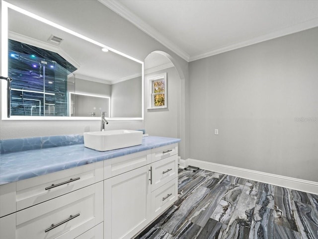 bathroom featuring ornamental molding and vanity