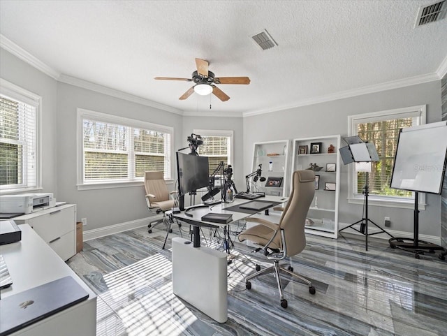 office space featuring ornamental molding, ceiling fan, and a textured ceiling