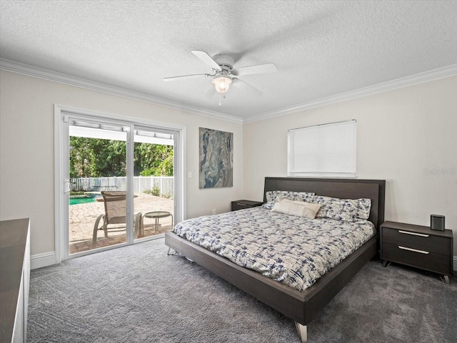 carpeted bedroom with access to outside, ornamental molding, and a textured ceiling