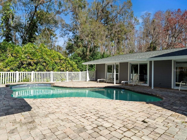 view of swimming pool with a patio area