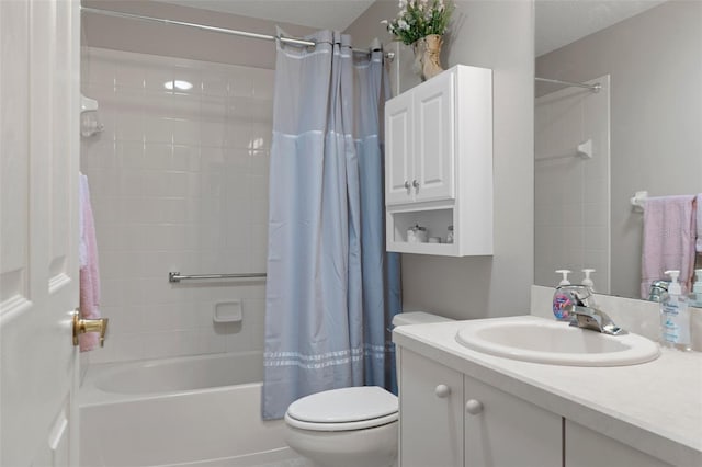 full bathroom featuring shower / tub combo with curtain, vanity, and toilet