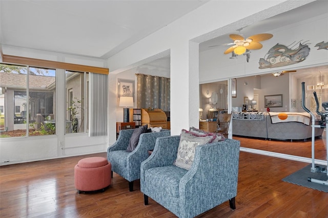 living room featuring hardwood / wood-style flooring and ceiling fan