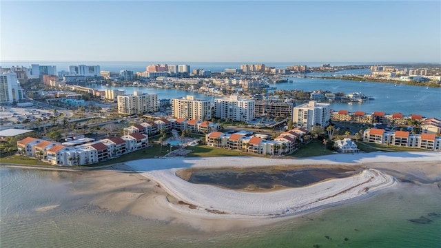 drone / aerial view featuring a view of the beach and a water view