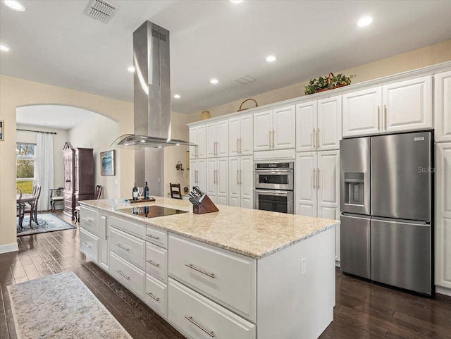 kitchen featuring a kitchen island with sink, stainless steel appliances, white cabinets, and island exhaust hood