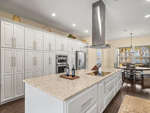 kitchen featuring pendant lighting, dark wood-type flooring, white cabinetry, stainless steel appliances, and island exhaust hood