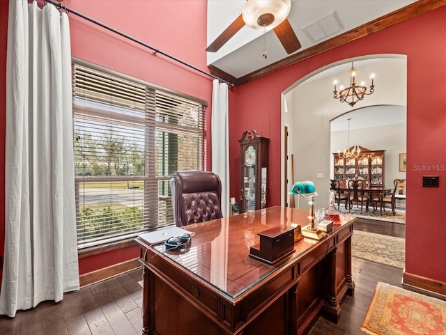 office space with ceiling fan with notable chandelier and dark wood-type flooring