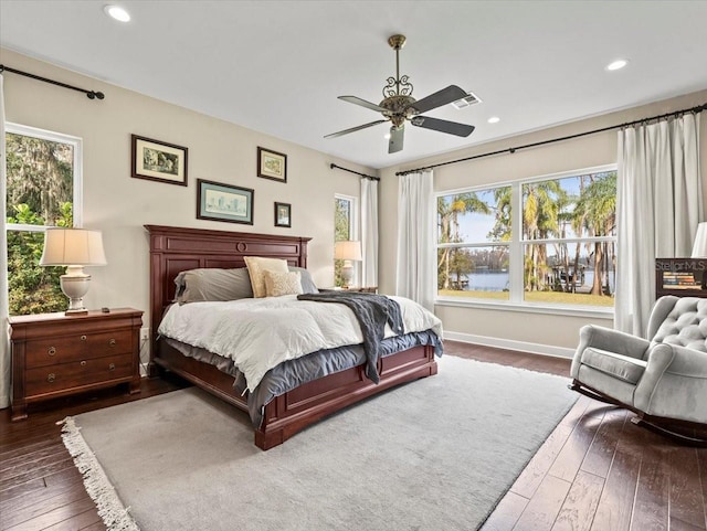 bedroom featuring dark wood-type flooring and ceiling fan