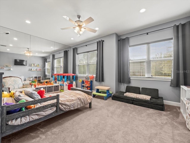 carpeted bedroom featuring ceiling fan