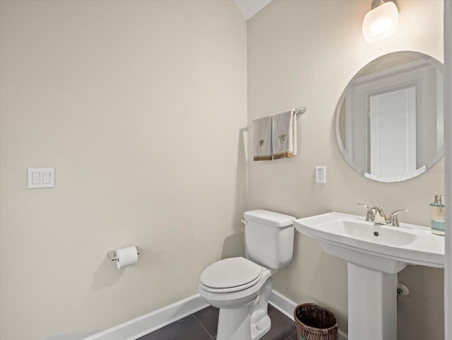 bathroom with tile patterned floors and toilet