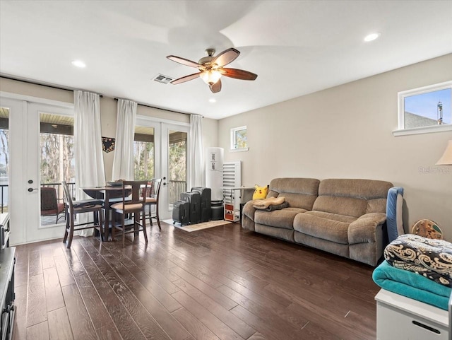 living room with french doors, ceiling fan, plenty of natural light, and dark hardwood / wood-style flooring