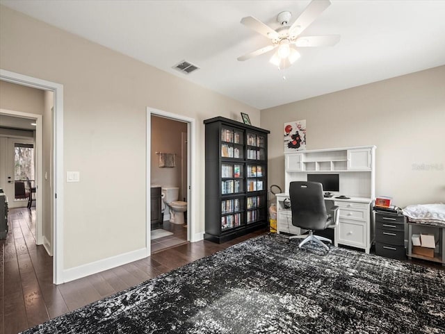 office area with dark wood-type flooring and ceiling fan