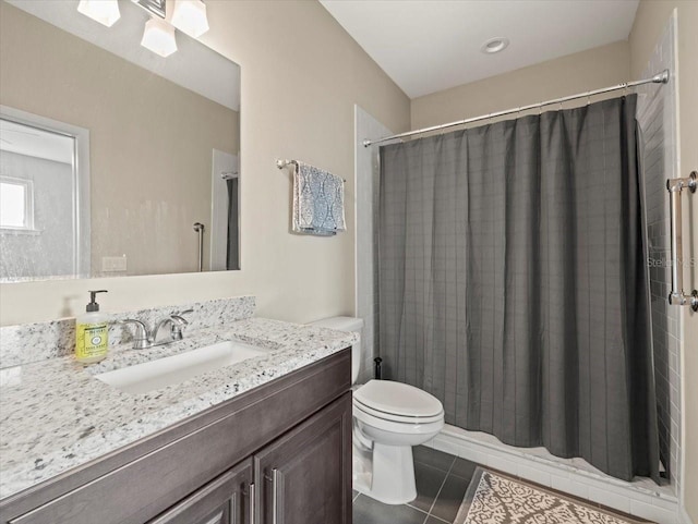 bathroom with walk in shower, tile patterned floors, toilet, and vanity