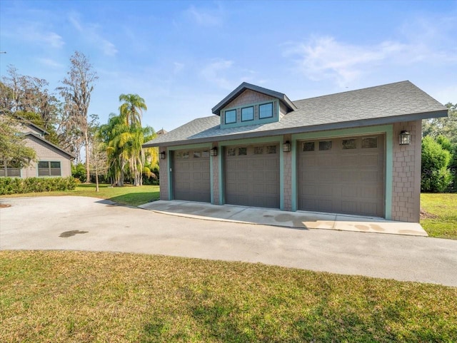 garage featuring a yard