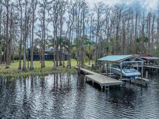 dock area featuring a water view and a lawn