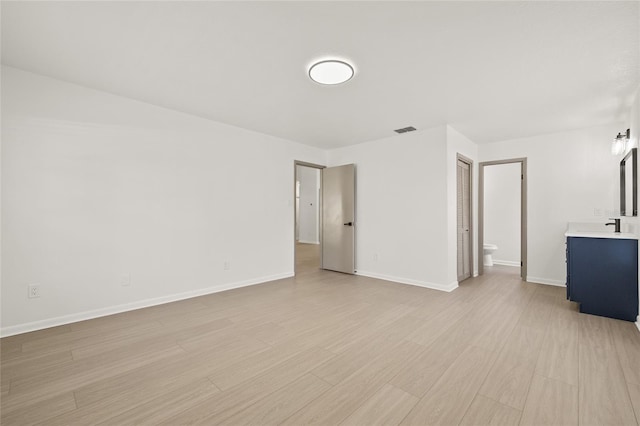 spare room featuring light hardwood / wood-style flooring