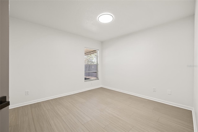 spare room featuring light wood-type flooring