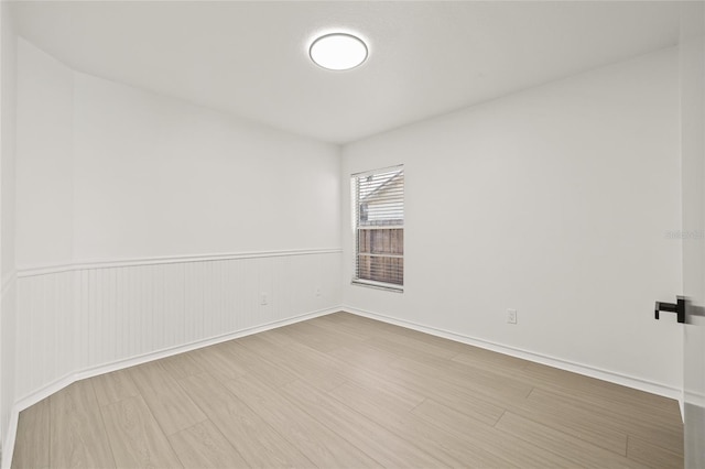 spare room featuring hardwood / wood-style flooring