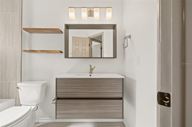 bathroom with vanity, toilet, and walk in shower