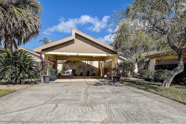 view of vehicle parking with a carport