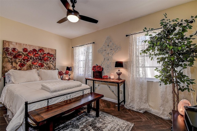 bedroom featuring dark parquet flooring and ceiling fan