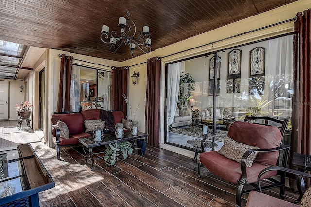 interior space with hardwood / wood-style floors, a notable chandelier, and wood ceiling